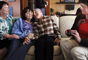 Jerry Wooliver, center right, meets sisters Julie Martin, left, Karen Newman and Janis MacPherson for the first time. Wooliver was born with cerebral palsy and was removed from his mother's home 61 years ago. Martin and MacPherson are twins. (Alan Berner/Seattle Times/MCT)