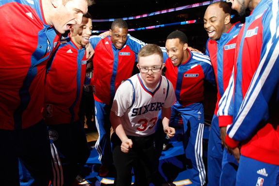 Kevin Grow, who has Down syndrome, joined the Philadelphia 76ers in a pre-game chant. The team signed Grow to a two-day contract this week after video of him playing in a high school game went viral. (Ron Cortes/Philadelphia Inquirer/MCT)