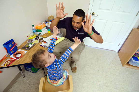 Behavior specialist Lamar Williams conducts a therapy session at an autism center in Prestonsburg, Ky. A new review finds more evidence backing behavioral intervention for kids with autism. (John Flavell/Lexington Herald-Leader/MCT)