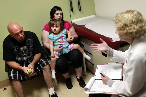 Genetic counselor Michelle Fox, right, talks with William Hanberg and Heather Spear about development concerns with their daughter EmmaRose. The American Academy of Pediatrics is putting out new recommendations for doctors diagnosing children with intellectual disability and global developmental delay. (Jay L. Clendenin/Los Angeles Times/MCT)