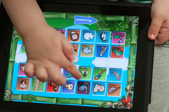 A new study finds that using tablet devices during therapy can help children with autism make greater strides in communication. (John Flavell/Lexington Herald-Leader/MCT)