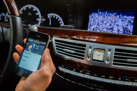 An Uber driver checks the company's app. The ride-sharing service is being sued for allegedly discriminating against passengers with disabilities. (Zbigniew Bzdak/Chicago Tribune/MCT)