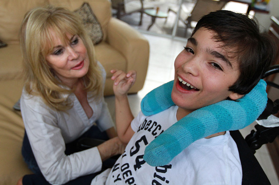 Judy Susser, left, of Boca Raton, Fla, with her son Adam, who has cerebral palsy. A new study suggests that adolescents with cerebral palsy have a quality of life comparable to their peers without the condition. (Carline Jean/Sun Sentinel/MCT)