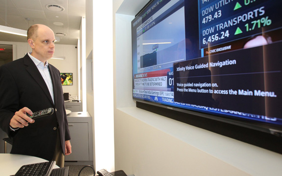 Tom Wlodkowski, a Comcast Corp. executive who is blind, demonstrates new features the company is rolling out designed to make television more accessible for people with disabilities. (Charles Fox/Philadelphia Inquirer/TNS)