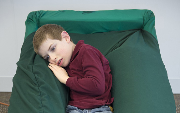 Joshua Jackson, who has autism, finds comfort in the Sensory Lounger. The chair, which is designed to provide a soothing, full-body hug much like Temple Grandin's 